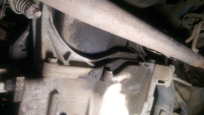 Looking almost directly upward, toward the passenger side of the pan. Huge transmission bracket in the way.
